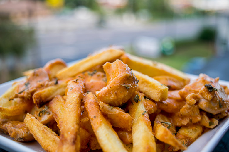 Butter Chicken Fries – Crispy French Fries topped with lusciously creamy Butter Chicken.